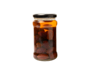 Delicious red olives in a jar isolated on white background. Pickled olives in a glass jar. Delicious olives. Close-up. Vegan.