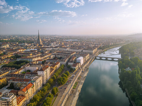 The drone aerial view of Turin city centre with Mole Antonelliana at sunrise, Piedmont region of Italy.