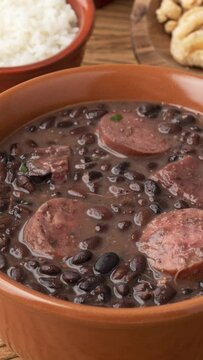 Typical brazilian feijoada with kale, rice and cracklings