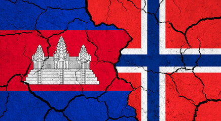 Flags of Cambodia and Norway on cracked surface - politics, relationship concept