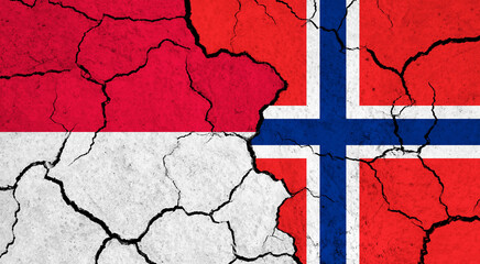 Flags of Monaco and Norway on cracked surface - politics, relationship concept
