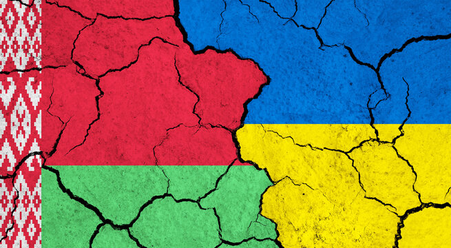 Flags of Belarus and Ukraine on cracked surface - politics, relationship concept