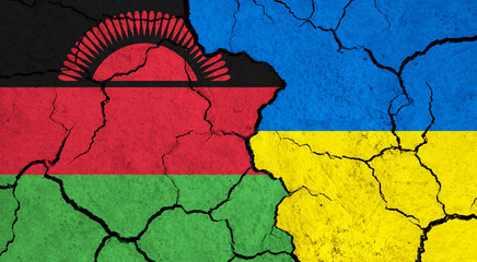 Flags of Malawi and Ukraine on cracked surface - politics, relationship concept