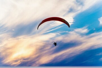 para sailing in manali in fog showing the popular adventure sport in hill stations like manali,...