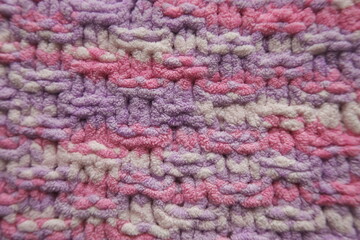 Pink and purple pastel color knitting pattern background
