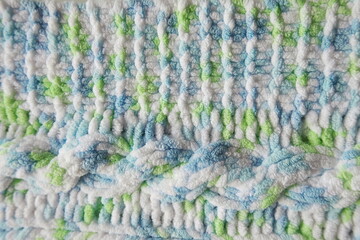 Blue and green Aran braid cable stitch knitting pattern background