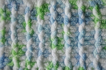 Blue and green Aran braid cable stitch knitting pattern background