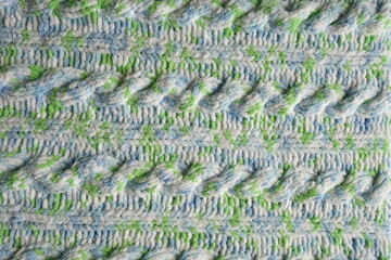 Blue and green Aran braid cable stitch knitting pattern background