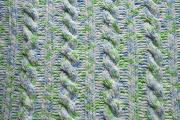 Blue and green Aran braid cable stitch knitting pattern background