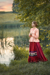 Photo of a girl in a folk costume.