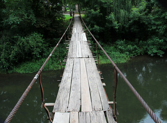 Wooden bridge across the river