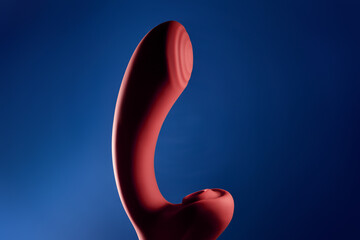 Adult sex toys, vacuum clitoral massager dildo on colored background, vibrator for women - obrazy, fototapety, plakaty