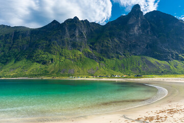 The crystal clear water of the Ersfjordstranda beach in Senja Island,  Norway