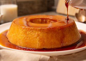 Creme Caramel Condensed Milk Pudim with melting caramel topping in front view