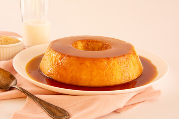 Creme Caramel Condensed Milk Pudim with melting caramel topping in front view