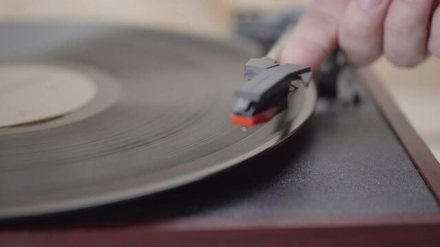 Close up of a a needle Vinyl Record player Spinning.