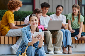 back to school, happy girl holding digital tablet, diversity, blur, teacher and students, e-learn