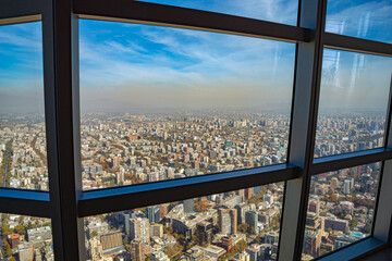 glass window dirty by pollution in the background seen from the city of Santiago in Chile