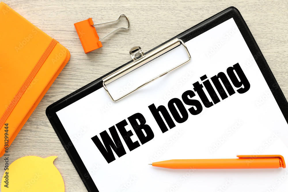 Poster text on white paper on black folder. wooden background. text on paper. web hosting
