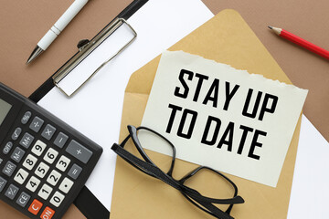 text on a torn page from a notebook.on an envelope.words Stay Up-to-Date