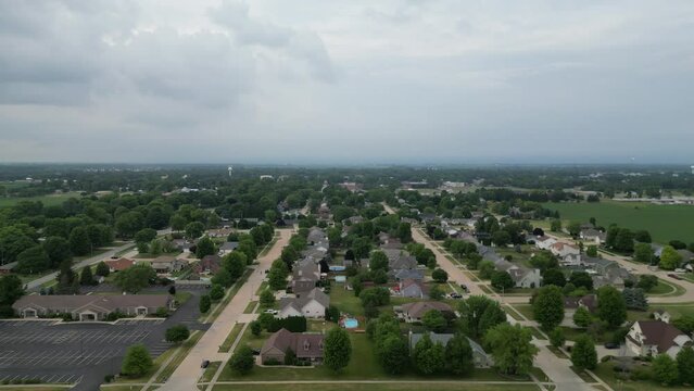 This is a sliding shot moving from left to right over a small Illinois suburb residential area.