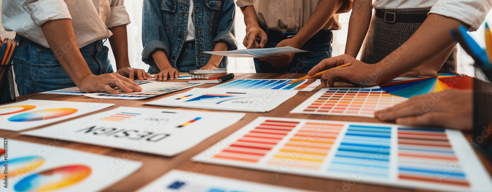 Aufkleber Graphic designer brainstorm logo and graphic art at busy creative studio workshop. Experiment and brainstorm color palette and pattern at workspace table for creative design. Panorama shot. Scrutinize