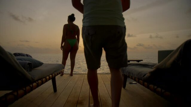 Man proposes at sunset in luxury vila