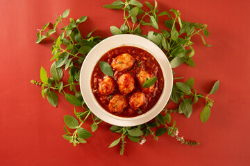 Delicious Gnocchi with Red Sauce and Basil in Handcrafted Ceramic Pot top view