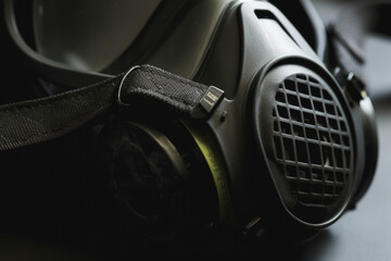 Extreme close-up of a high-performance respirator mask with adjustable straps for the best fit and protection from harmful airborne particles and replaceable filters