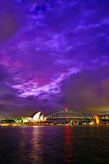 Sydney Opera house and harbor bridge under moody skies. Sydney, Australia. 