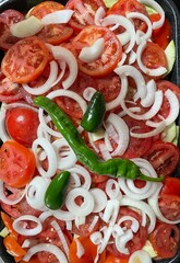 Ratatouille layered vegetables topped with hot pepper