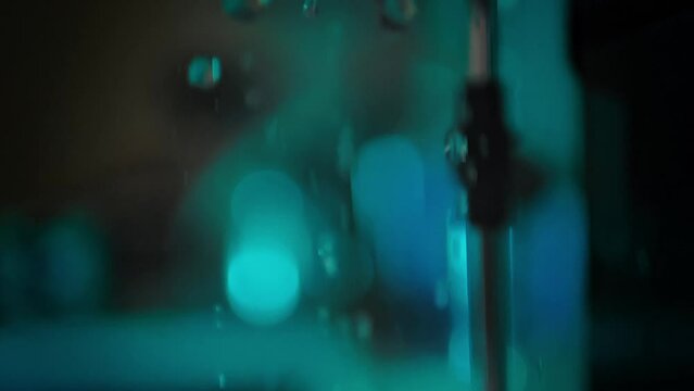 Spilling water in the coffee machine before making coffee in slow motion