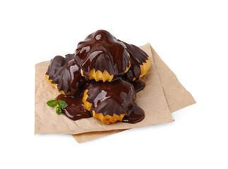 Delicious profiteroles with chocolate spread and mint isolated on white