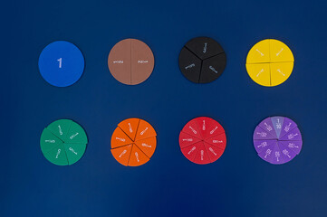 Colorful math fractions, numbers, letters on blue background. Interesting, fun, creative...