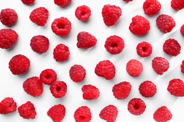 Tasty ripe raspberries on white background, flat lay