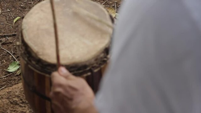 detail of hands playing timbal percussion instrument