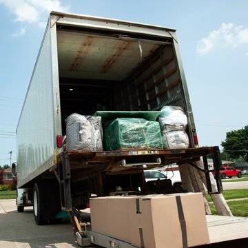 Big Moving truck with household stuff loading for home moving in the United States