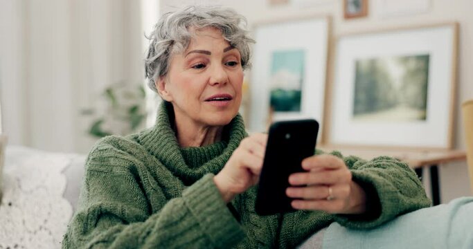 Senior woman, phone and typing for social media, online browsing or scrolling on living room sofa at home. Happy elderly female person busy on mobile smartphone app for streaming or entertainment