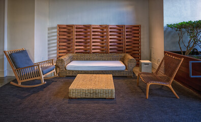 Rattan Patio Furniture with a White Wall Background.