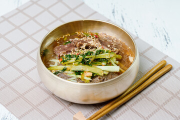 Yeolmunaengmyeon, korean style Buckwheat Noodles with YoungSummer Radish Kimchi, This dish features cold noodles in kimchi soup that is made by mixing salted young radish with chopped onion
