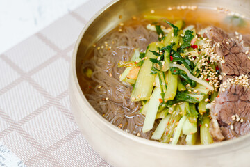 Yeolmunaengmyeon, korean style Buckwheat Noodles with YoungSummer Radish Kimchi, This dish features cold noodles in kimchi soup that is made by mixing salted young radish with chopped onion