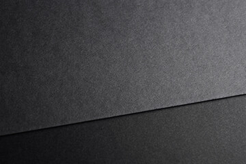 Black paper on dark grey background mockup template for stationery design