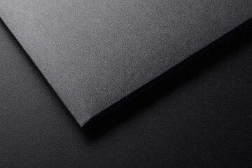 Black paper folder on dark grey background mockup template for stationery design