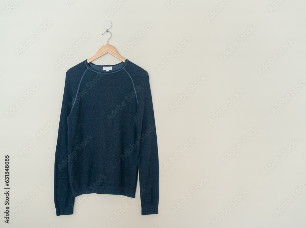 Sticker navy sweater hanging with wood hanger