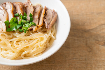 dried duck noodles in white bowl