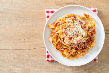 Homemade pasta fettuccine bolognese with cheese