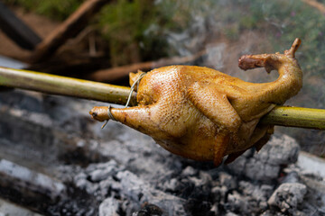 spit roasted chicken over coals