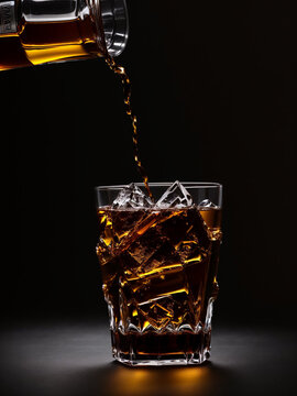 Glass of whiskey glistens with a warm amber hue, inviting a sense of sophistication and indulgence.