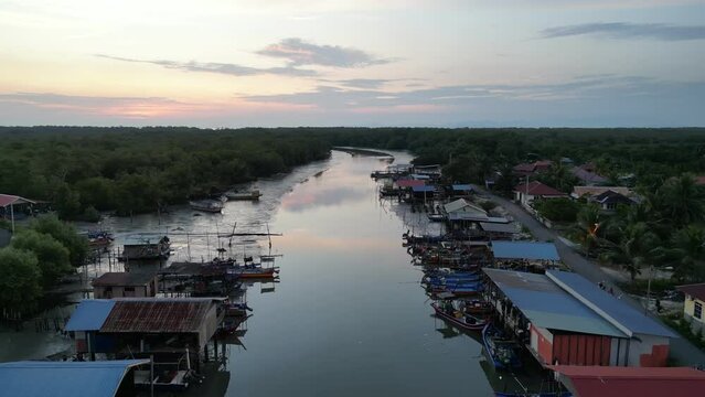 River surrounded by lots of boats at Bagan Tiang fishing village
