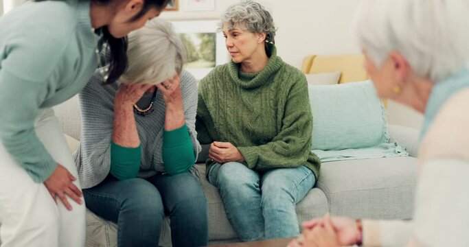 Sympathy, grief and elderly woman with family crying for loss, sadness or depression in living room. Mental health, emotions and senior female person comforting friend in sorrow for empathy at home.